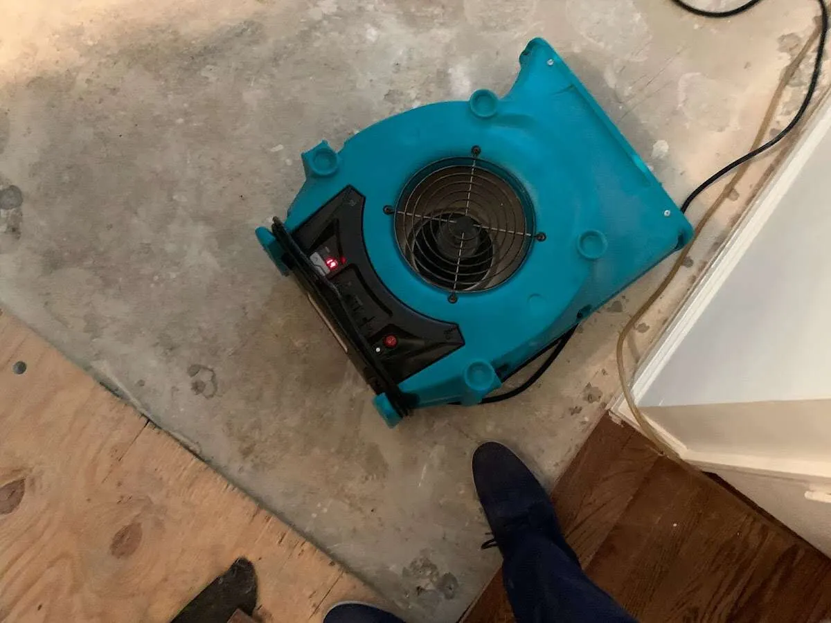 Air mover drying subfloor during Leak Detection & Repair in Silver Springs